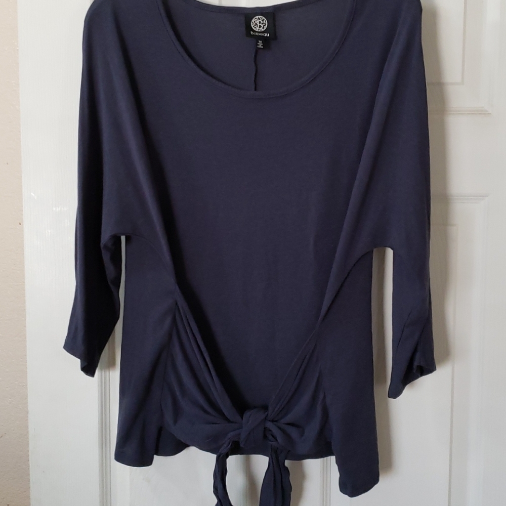 Blue top with tie waist detail.